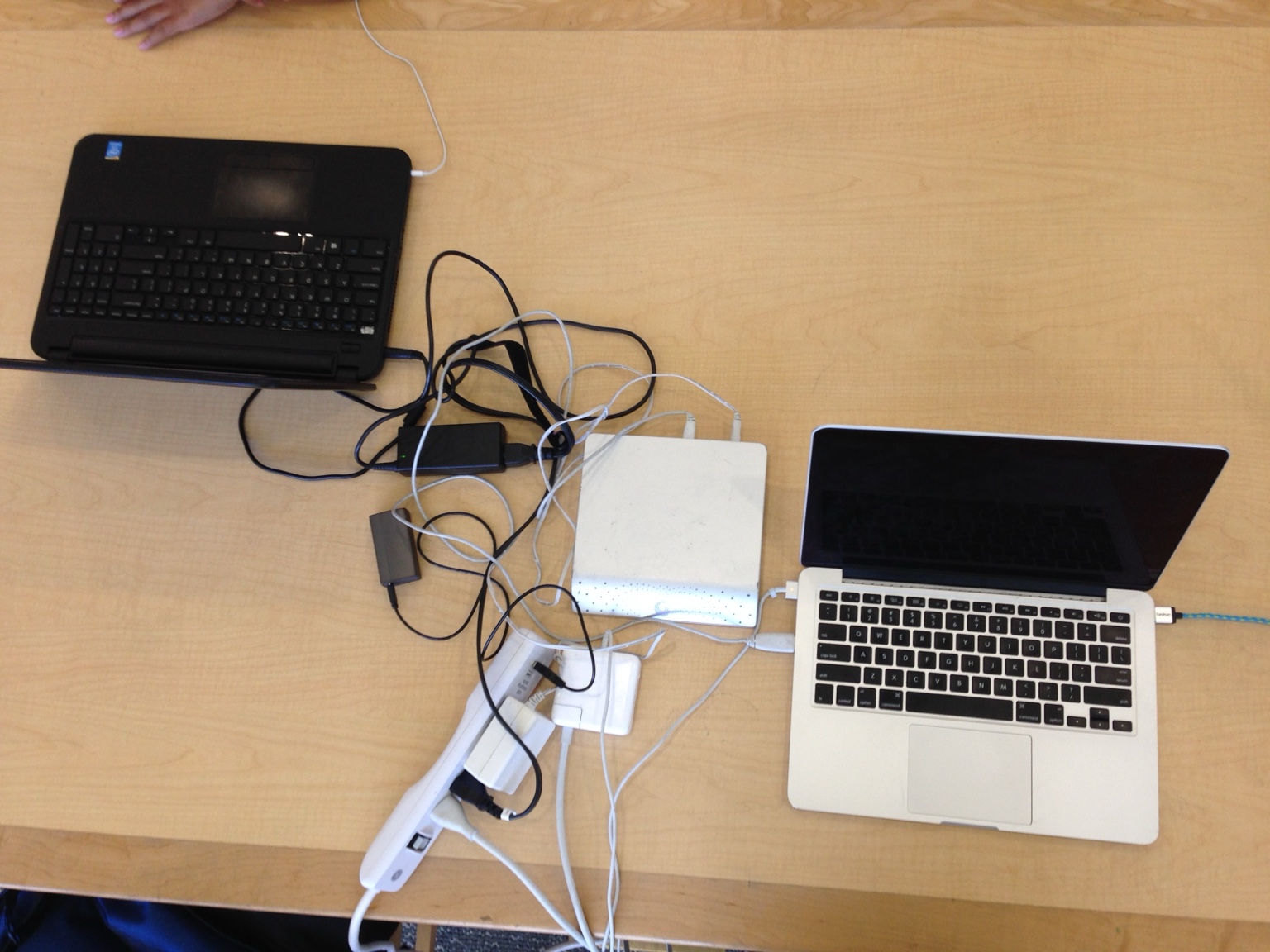 Two laptops open while working and studying on the road.